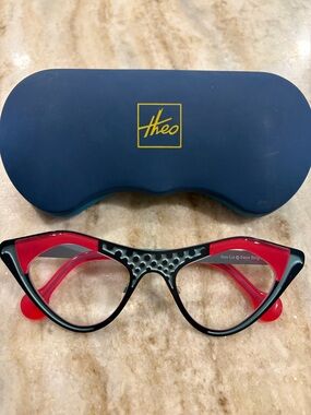 Theo Cat-Eye Eyeglasses Frame in Black & Red model Liz with branded case